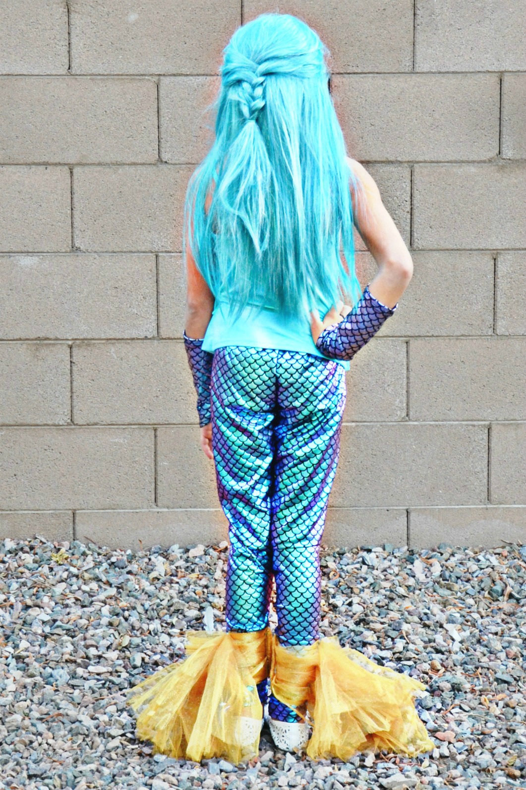 Learn how to add a mermaid fin tail to leggings for an easy DIY mermaid costume. Add accessories to complete the magical look.