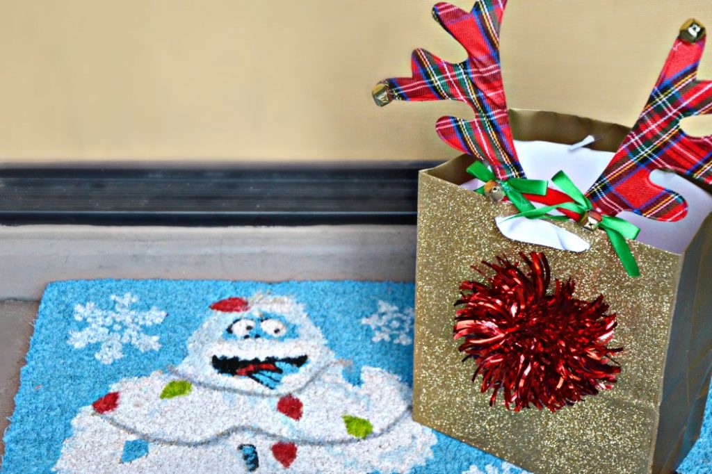 Make an easy reindeer gift bag for your family Rudolph pajamas delivery. Put pajamas in the bag, leave on your doorstep and let your children find the gift.