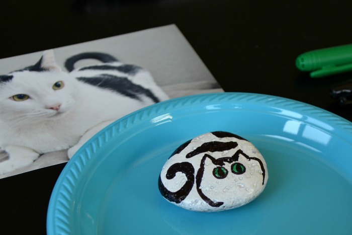 Use a photo of your pet as inspiration when you're painting rocks. Then turn your art into cat rock magnets to display favorite pet photos.