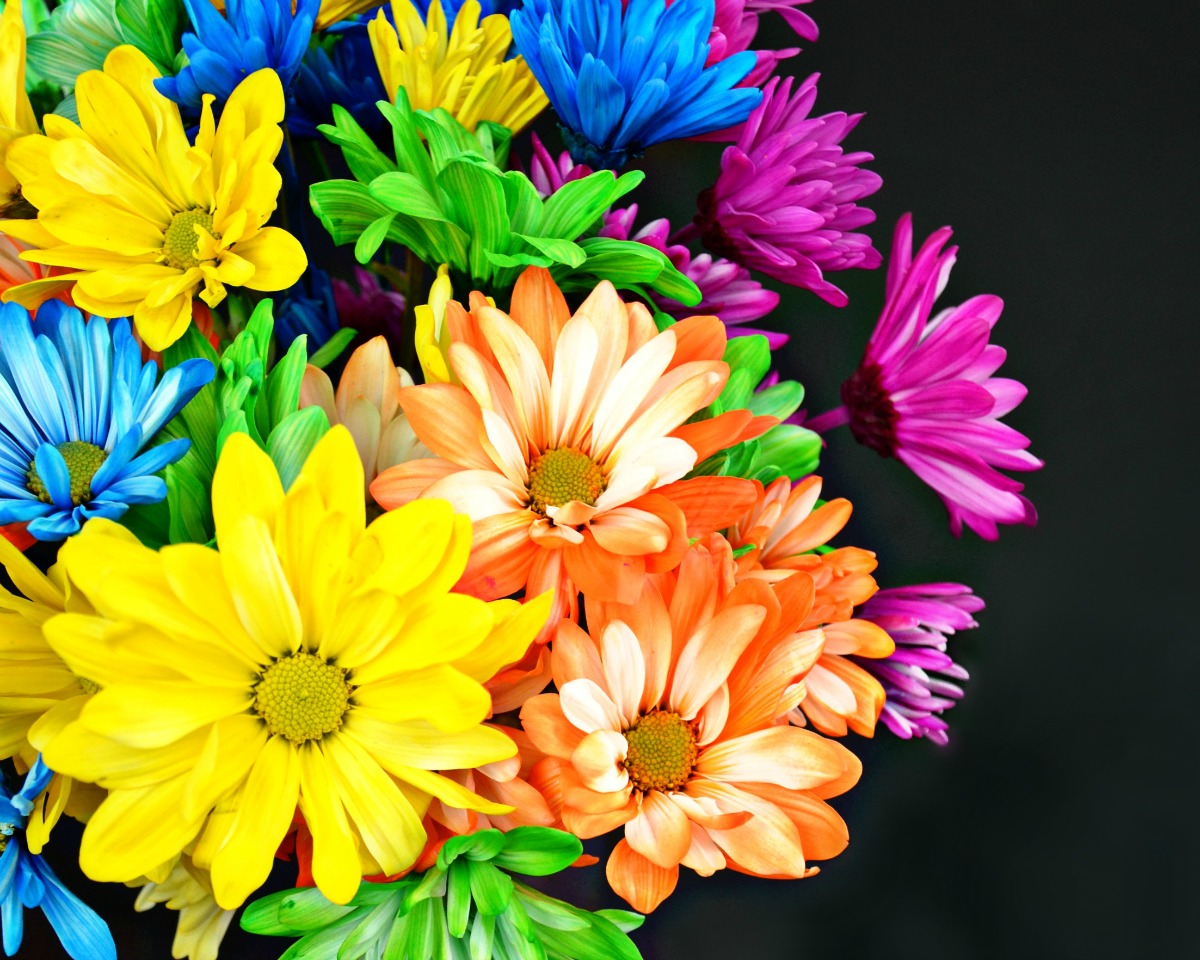 Rainbow flowers are the best to display with a neon cassette tape vase.