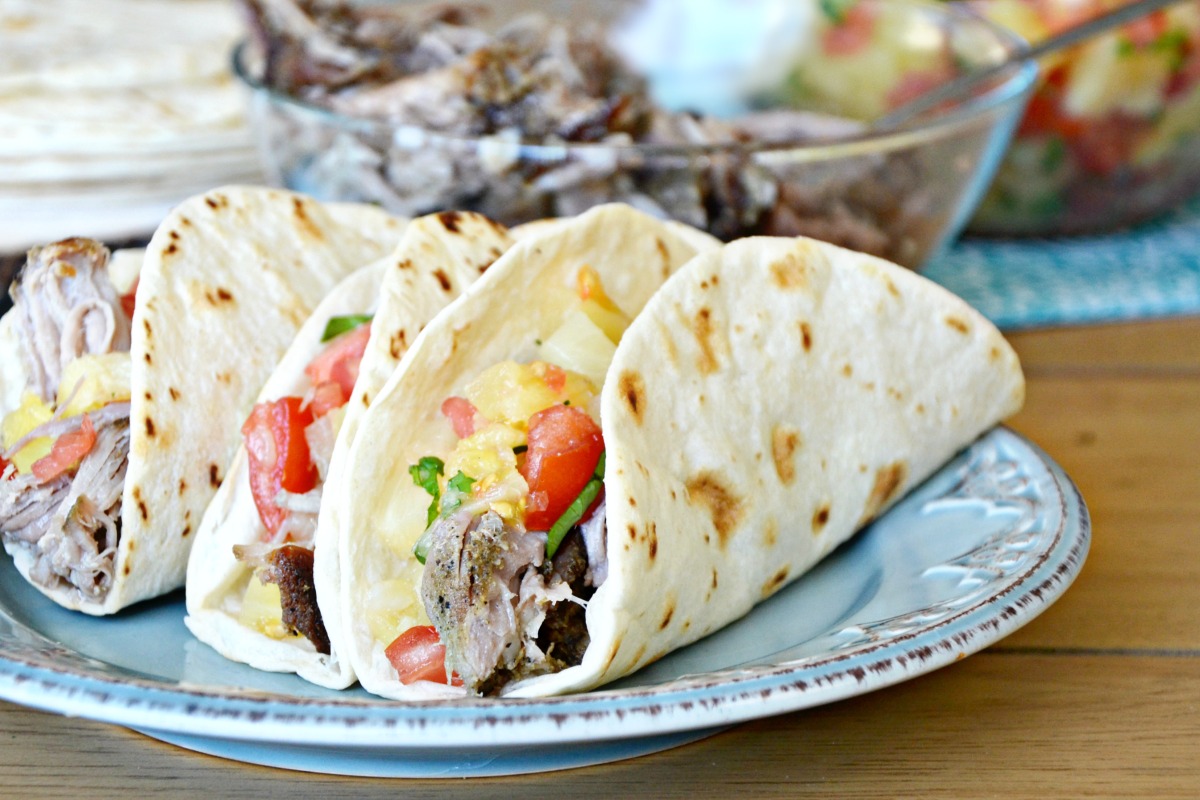 Pork tacos with pineapple salsa are a great summer meal.