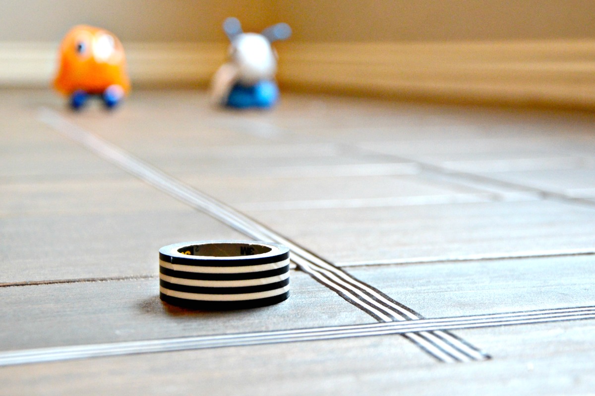 Use washi tape to make an indoor race track for your children to have toy races after you've changed the batteries in their power toys.