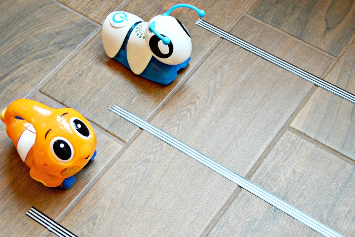 Make an easy race track with washi tape, change the batteries in toys and have a blast with indoor toy races!