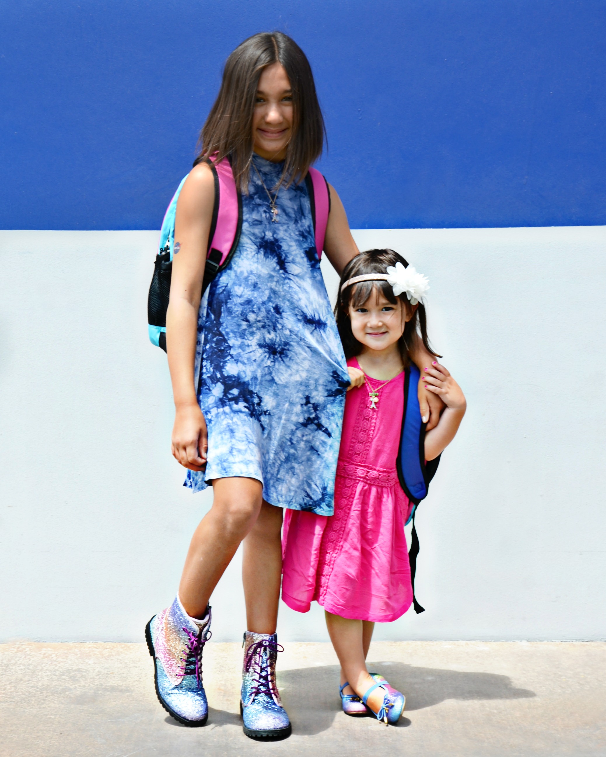 These sisters are ready to head back to school with matching rainbow glitter shoes from KidsShoes.