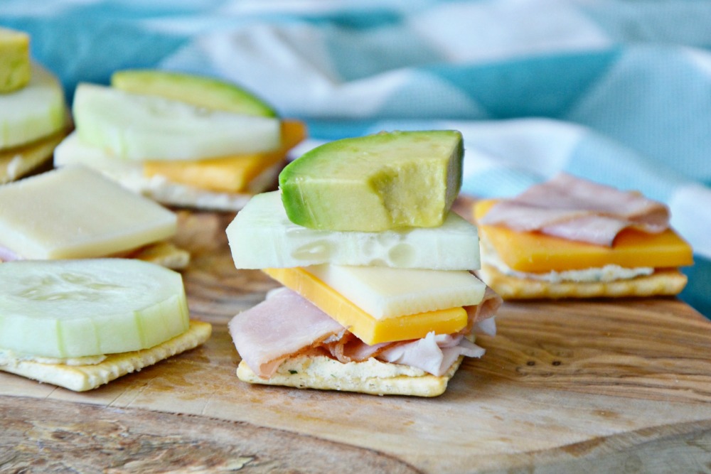 Stack a cracker sandwich with fresh veggies and produce for a yummy and easy lunch box idea.