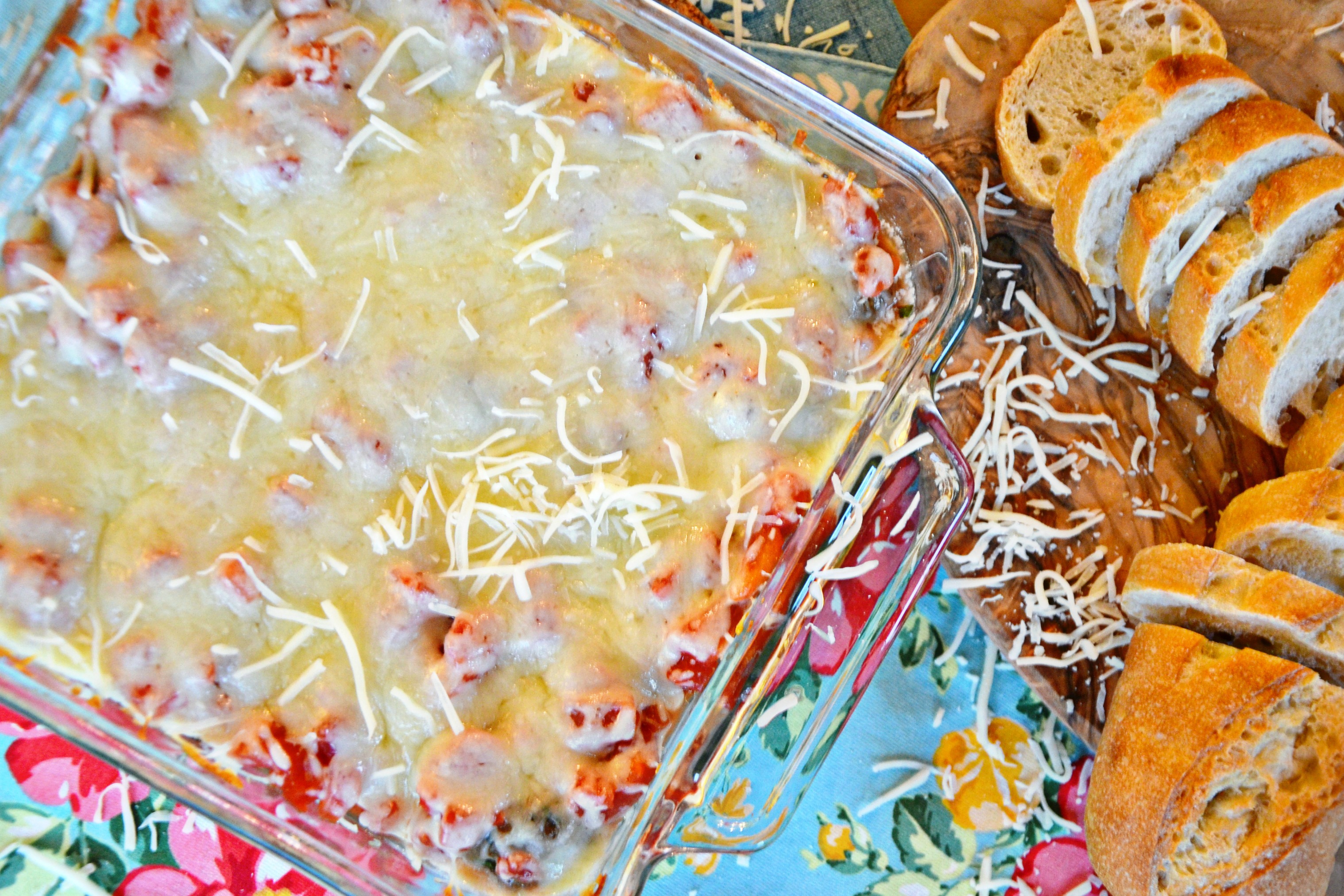 This yummy Italian meatball dip recipe is topped with mozzarella cheese and best served warm with bread.