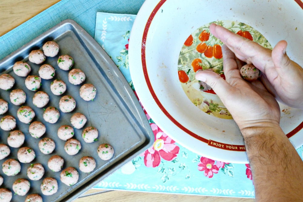 Making homemade meatballs is a great family activity in the kitchen.
