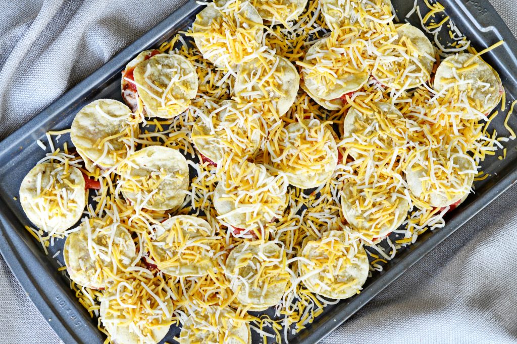 Add cheese to your Mexican Pizza Party Bites for a yummy appetizer.