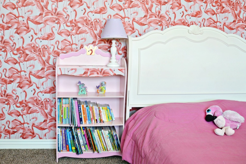 This flamingo bedroom is the cutest with peel and stick wallpaper. 