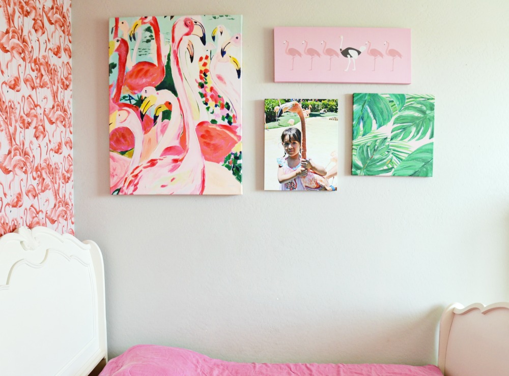 A canvas collage and flamingo wallpaper is perfect for this flamingo bedroom.
