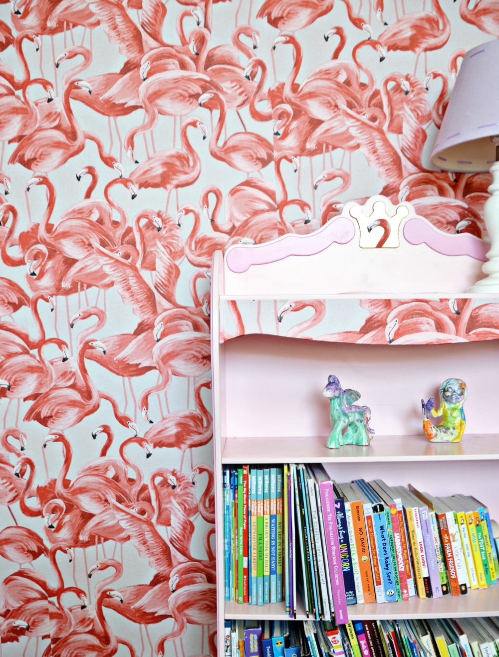 Create a flamingo bedroom for your child with peel and stick flamingo wallpaper.
