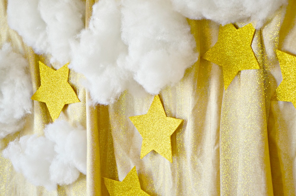This clouds and stars backdrop is easy to make and so pretty for party photo booths or behind a party table.